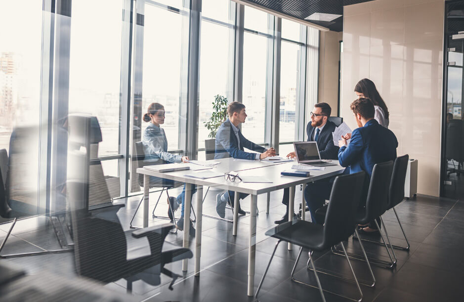 Meeting of five people in an office
